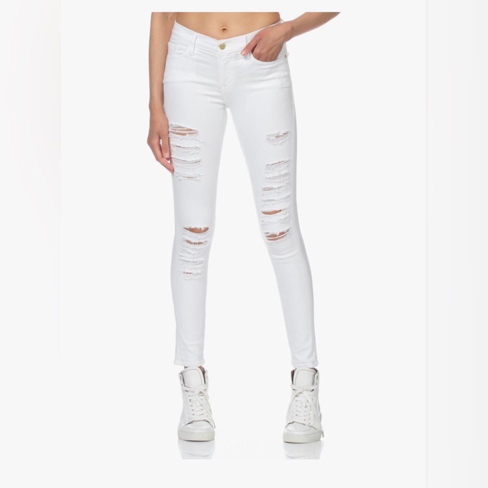 Frame le skinny de Jeanne. Super skinny stretch style, white distressed jeans.